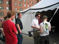 Silverstein and Hallie debate how to rig a disco ball while others look on.
