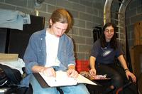 Ross and Maya filling out the event sheet.