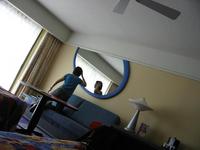 Natalie looking in the wacky mirror